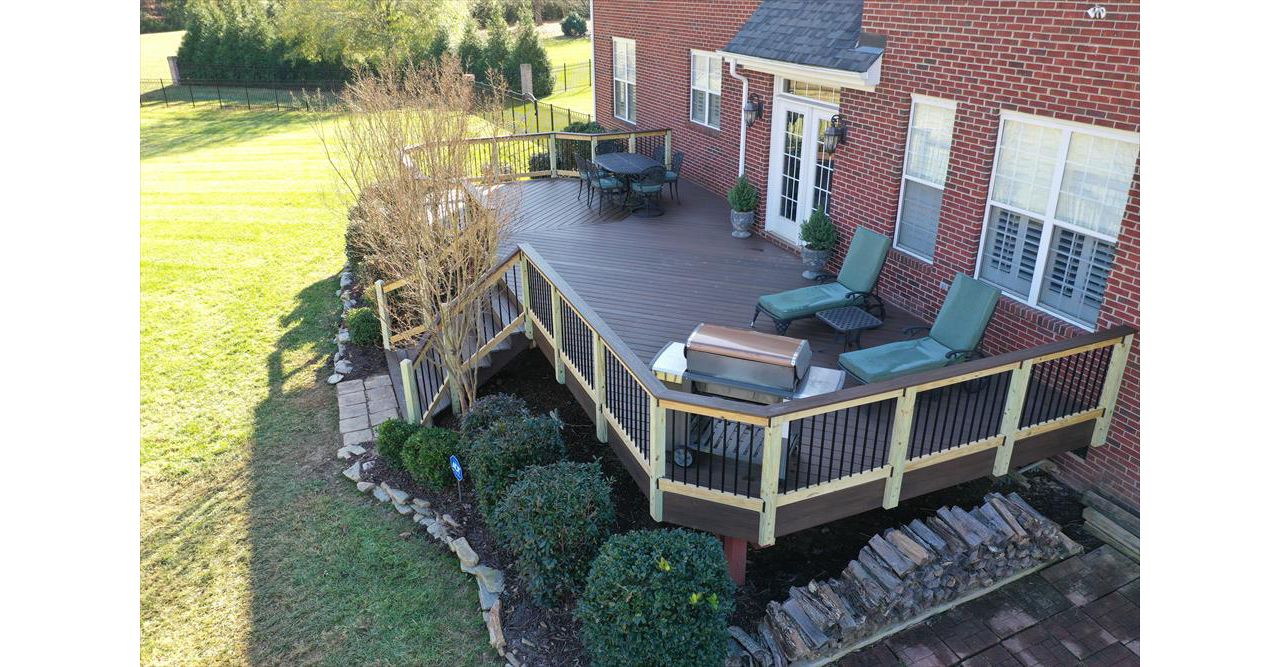 An expansive back of house Spiced Rum deck with offset seating area as well as room for lounge chairs and a grill area