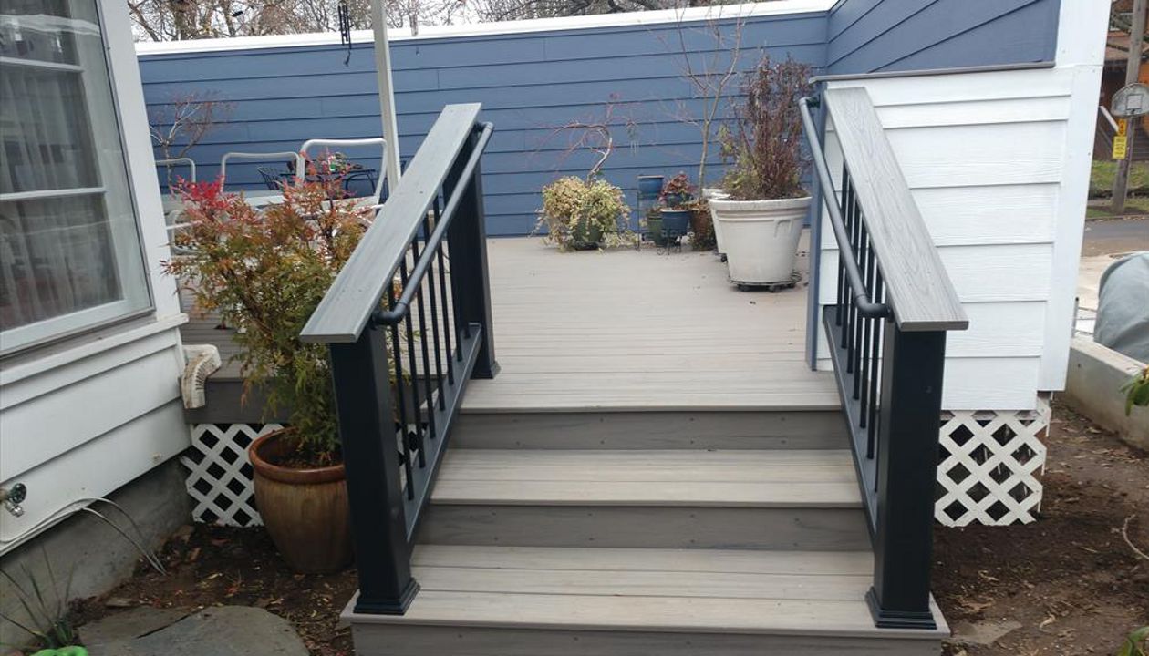 Trex Rocky Harbor decking with Transcend stair railings, and Trex ADA hand rails