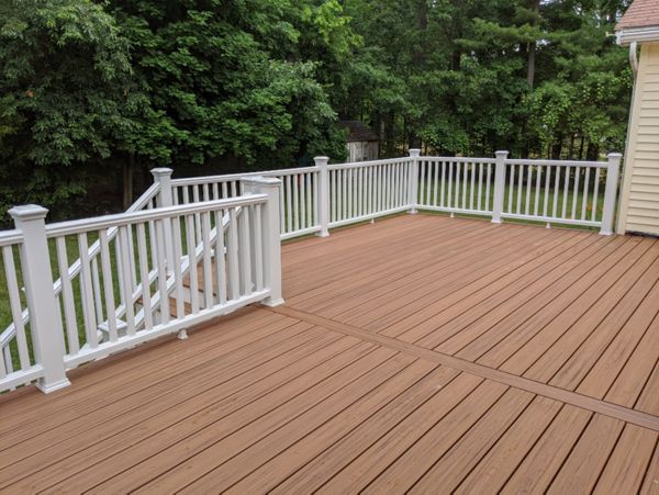 Trex Transcend "Tiki Torch" decking with white Transcend railings.