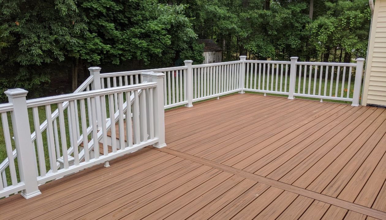 Trex Transcend "Tiki Torch" decking with white Transcend railings.