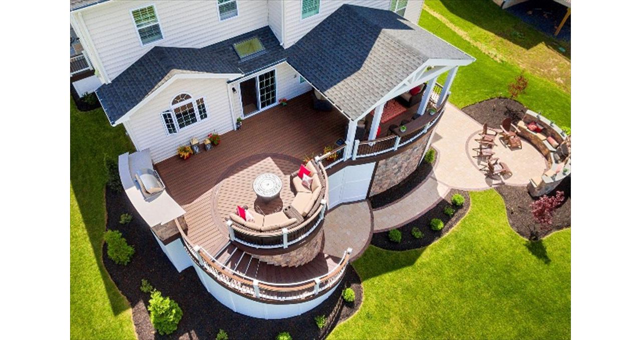 Trex Transcend Spiced Rum deck with Custom outdoor kitchen and stone accents.