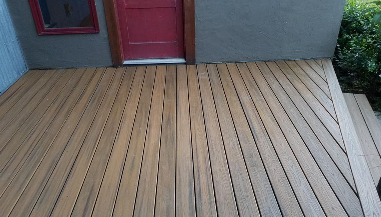 Trex Transcend Havana Gold Deck, Big Sky, MT. Front deck to main entry. Transcend Havannah Gold. (approx. 16' x 12') with 20 degree angle toward front step.