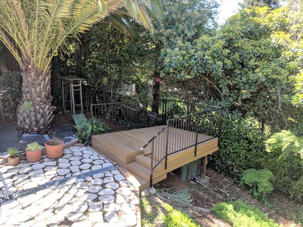 Custom Trex Havana Gold Deck in Redding, with hidden fasteners and custom railing in a backyard.  Majestic Builders is proud to provide top quality composite decks that will last a lifetime.