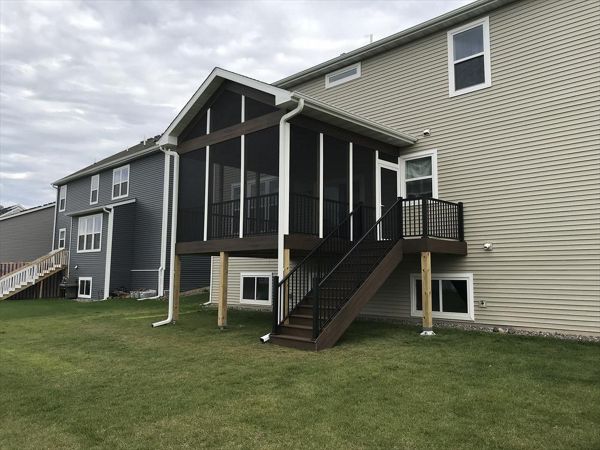 Maple Grove, MN screen porch with Trex spiced rum decking and fascia trim