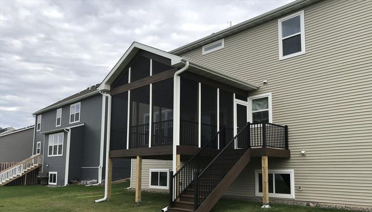 Maple Grove, MN screen porch with Trex spiced rum decking and fascia trim