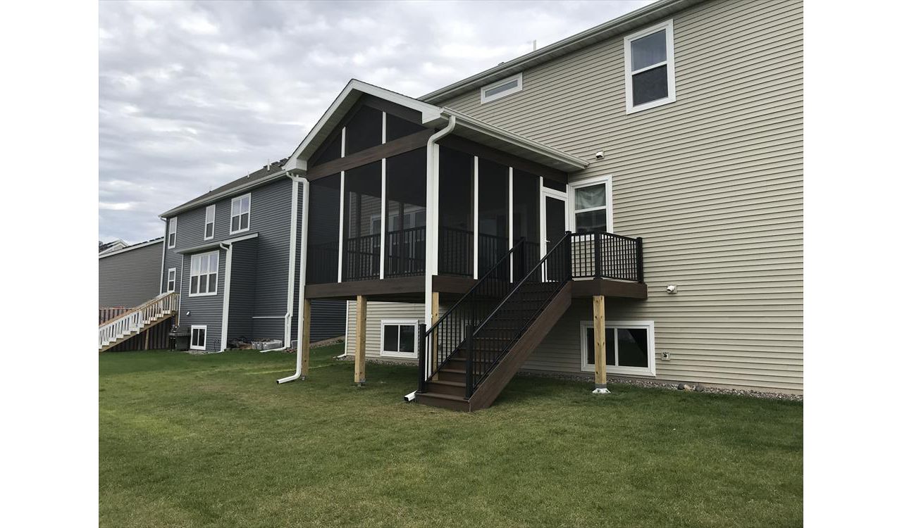 Maple Grove, MN screen porch with Trex spiced rum decking and fascia trim