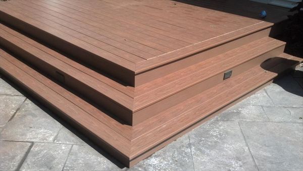 Wedding Cake Steps make this ground deck lead to all directions.  A custom pool deck is just around the corner in the Newtown CT dream deck. Don&amp;#39;t forget the deck lighting