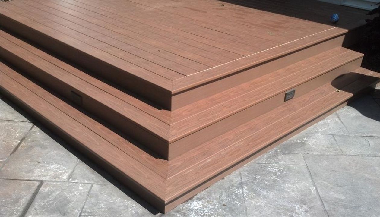 Wedding Cake Steps make this ground deck lead to all directions.  A custom pool deck is just around the corner in the Newtown CT dream deck. Don&amp;#39;t forget the deck lighting