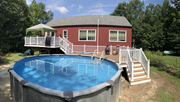 Multi level Havana Gold pool deck with lighted post caps