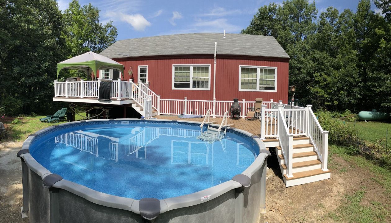 Multi level Havana Gold pool deck with lighted post caps