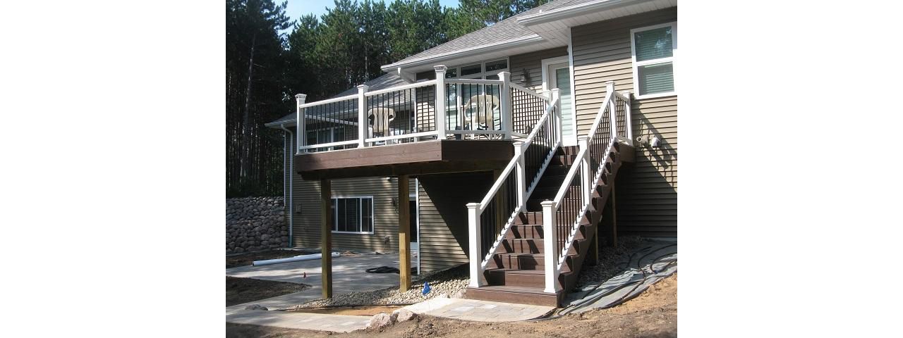 Suamico - Lava Rock decking, white Transcend railing