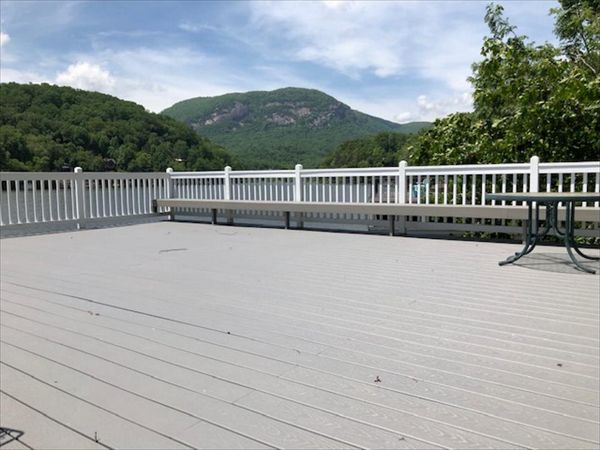 Trex Select Pebble Grey rooftop deck on this boathouse gives a great nautical feel