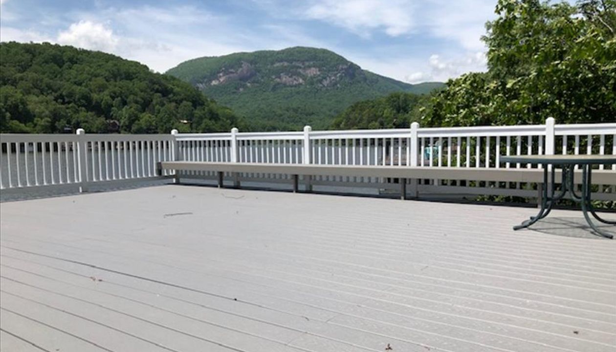 Trex Select Pebble Grey rooftop deck on this boathouse gives a great nautical feel