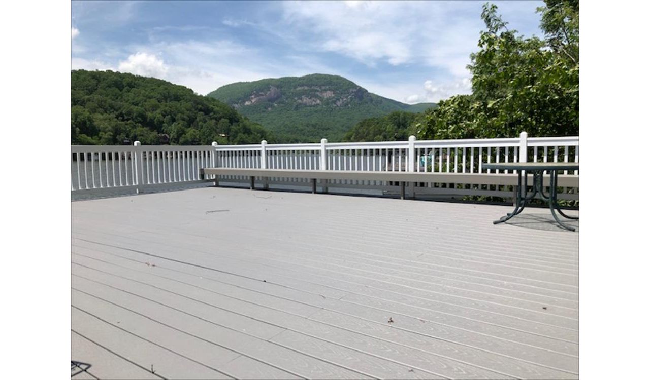 Trex Select Pebble Grey rooftop deck on this boathouse gives a great nautical feel