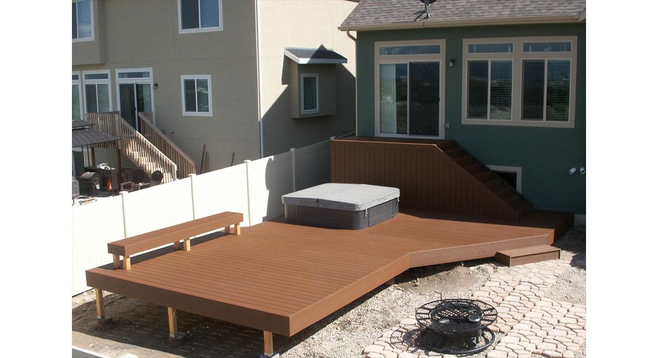 24x12 Trex saddle lower platform, skirted storage and built around hot tub with trex bench