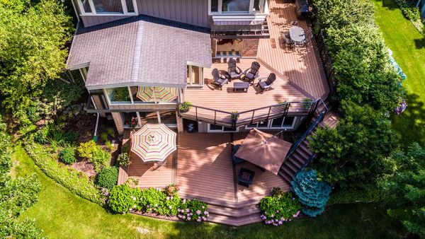 This Frank Lloyd Wright inspired home calls for an equally inspired outdoor living space. Matching the angles of the house, the deck serves as a true extension of the home.