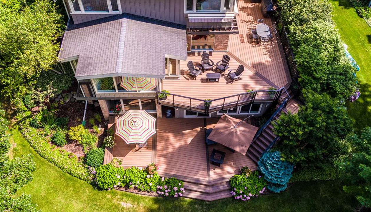 This Frank Lloyd Wright inspired home calls for an equally inspired outdoor living space. Matching the angles of the house, the deck serves as a true extension of the home.