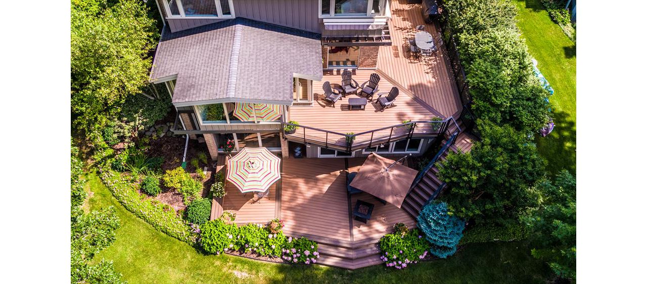 This Frank Lloyd Wright inspired home calls for an equally inspired outdoor living space. Matching the angles of the house, the deck serves as a true extension of the home.