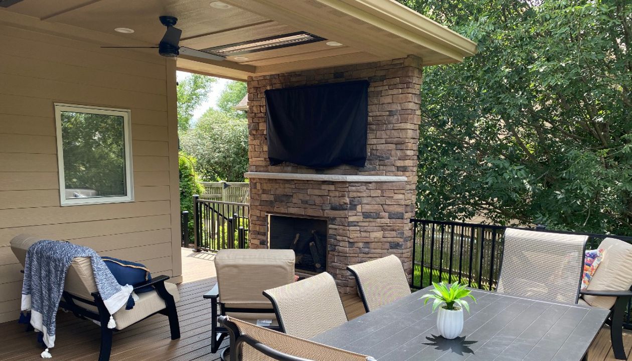 New covered deck with Transcend decking, Signature railing, and Trex Lighting - Better Builders of Iowa - Project in Urbandale