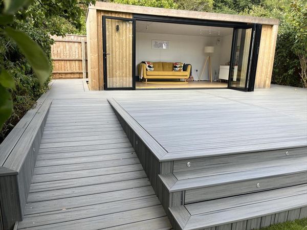 Trex transcend island mist decking, picture framed with a breaker board through the main field. Wheel chair access ramp with a full width steps with fascia lighting. Location Ipswich, Suffolk