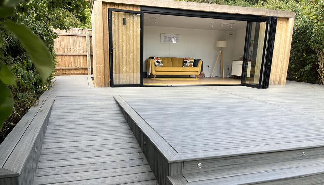 Trex transcend island mist decking, picture framed with a breaker board through the main field. Wheel chair access ramp with a full width steps with fascia lighting. Location Ipswich, Suffolk