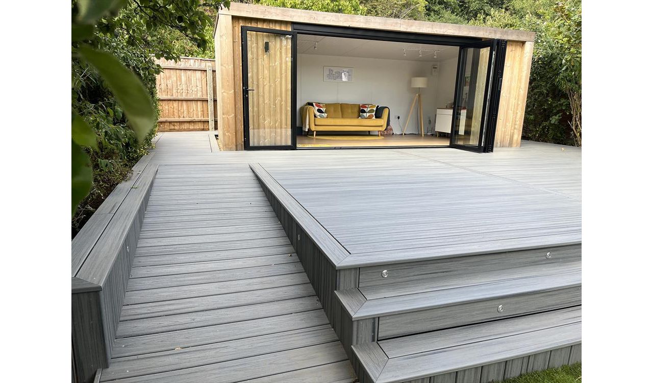 Trex transcend island mist decking, picture framed with a breaker board through the main field. Wheel chair access ramp with a full width steps with fascia lighting. Location Ipswich, Suffolk