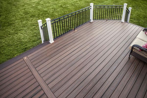 Combining beauty and durability, this Spiced Rum Trex Transcend decking in Kingwood, N.J.,  looks particularly sharp when paired with Vintage Lantern border and fascia.
