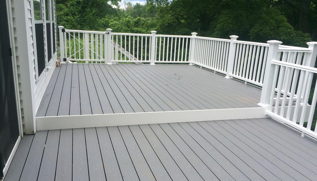 Select pebble grey decking, pvc trimboard risers and fascia, vinyl rails