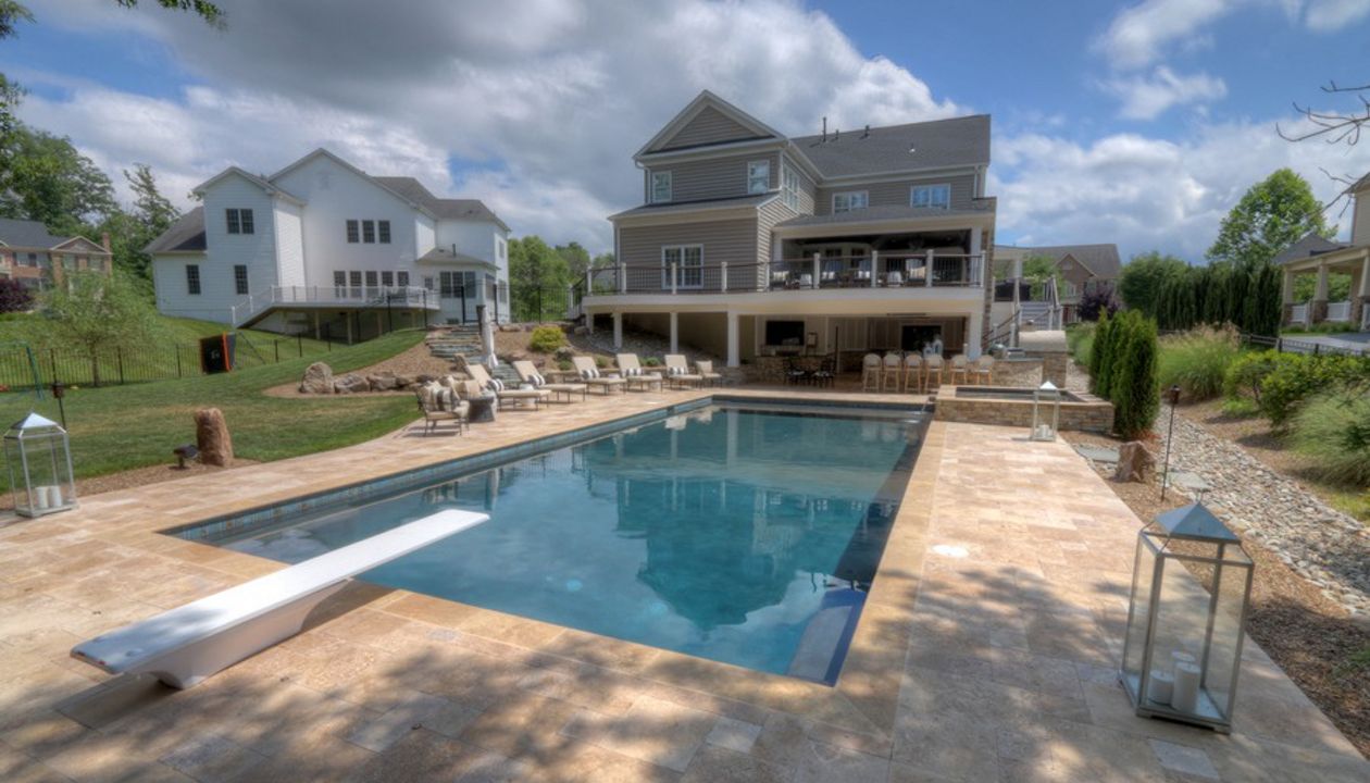 Trex Transcends Curved Deck, Open Porch, Fireplace, Rain Escapes, Travertine Patio, & Custom Pool