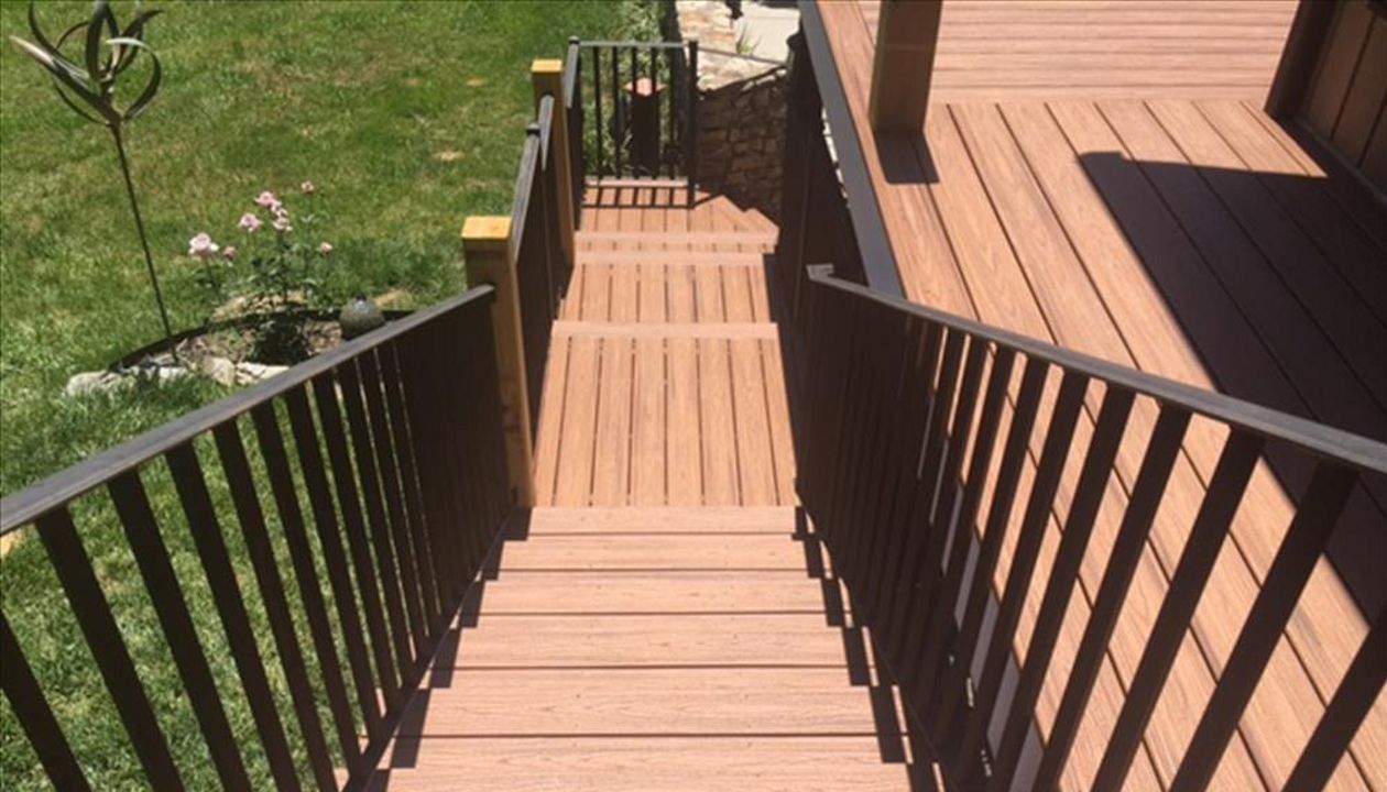 Trex Tiki Torch looks fantastic with black wrought iron