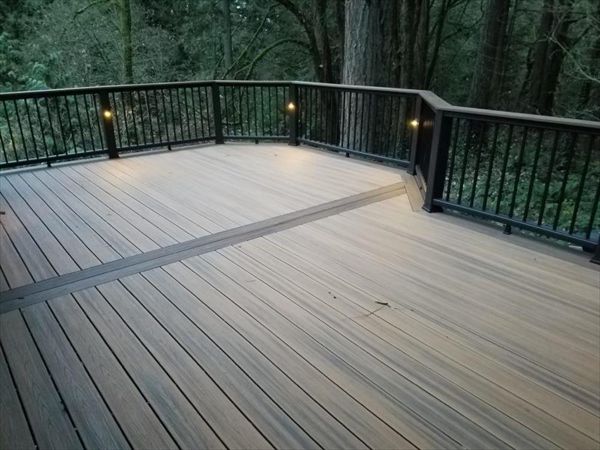 Trex Havana Gold Deck in Beaverton featuring Trex Transcend decking, railing and Trex accent lighting.