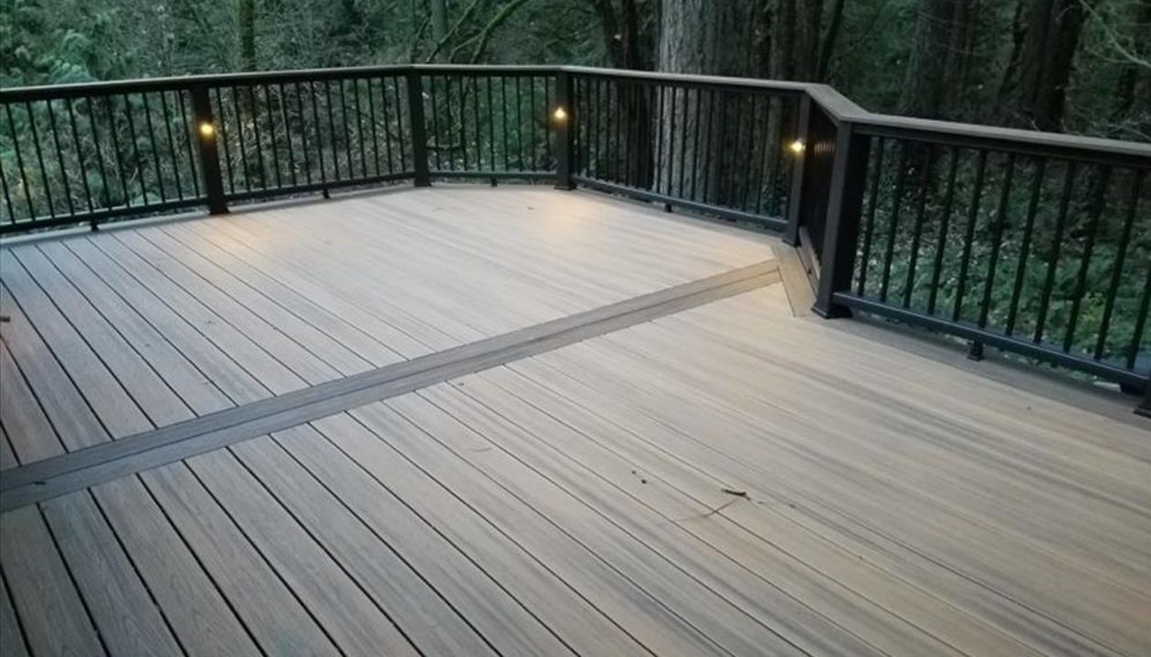 Trex Havana Gold Deck in Beaverton featuring Trex Transcend decking, railing and Trex accent lighting.