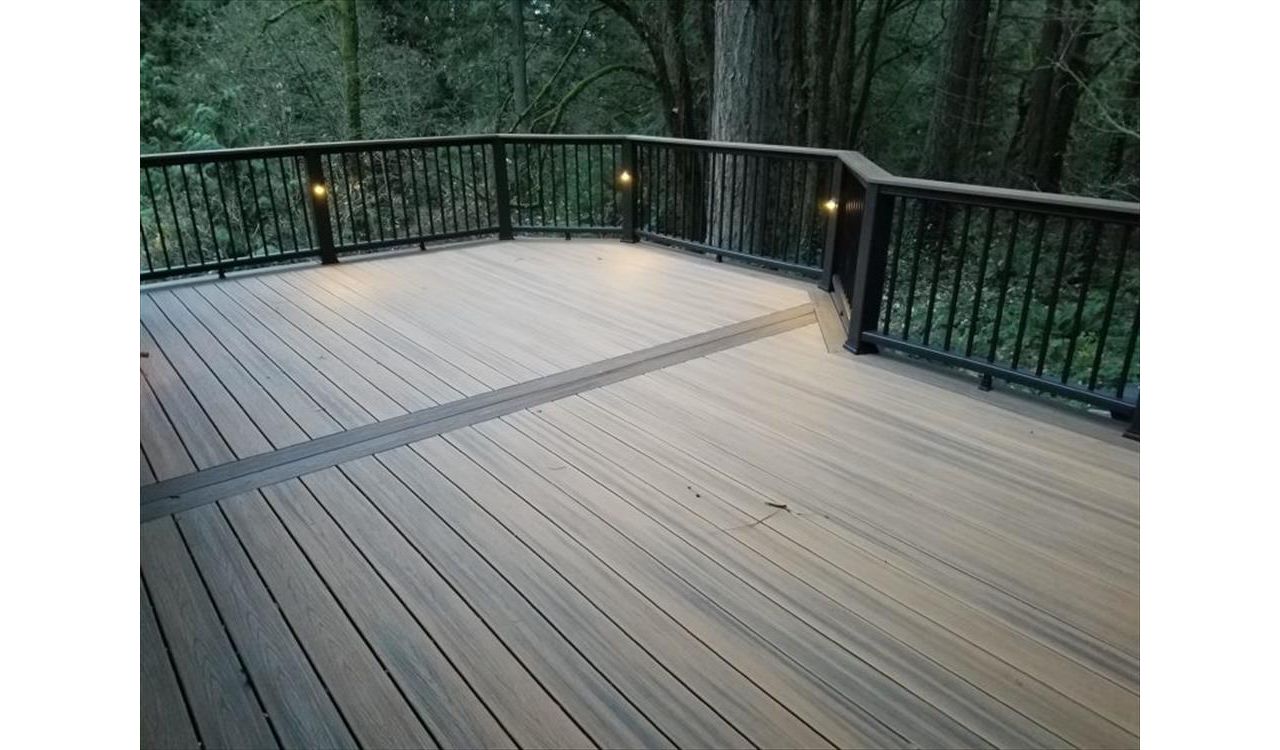 Trex Havana Gold Deck in Beaverton featuring Trex Transcend decking, railing and Trex accent lighting.