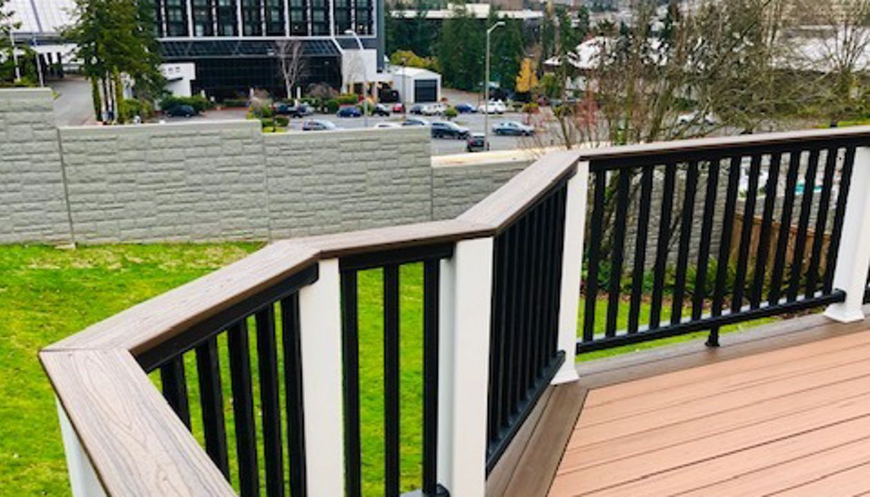 Trex Transcend Tiki Torch body w/ Spice rum boarder. Transcend railing w/ cocktail top cap and rain escape