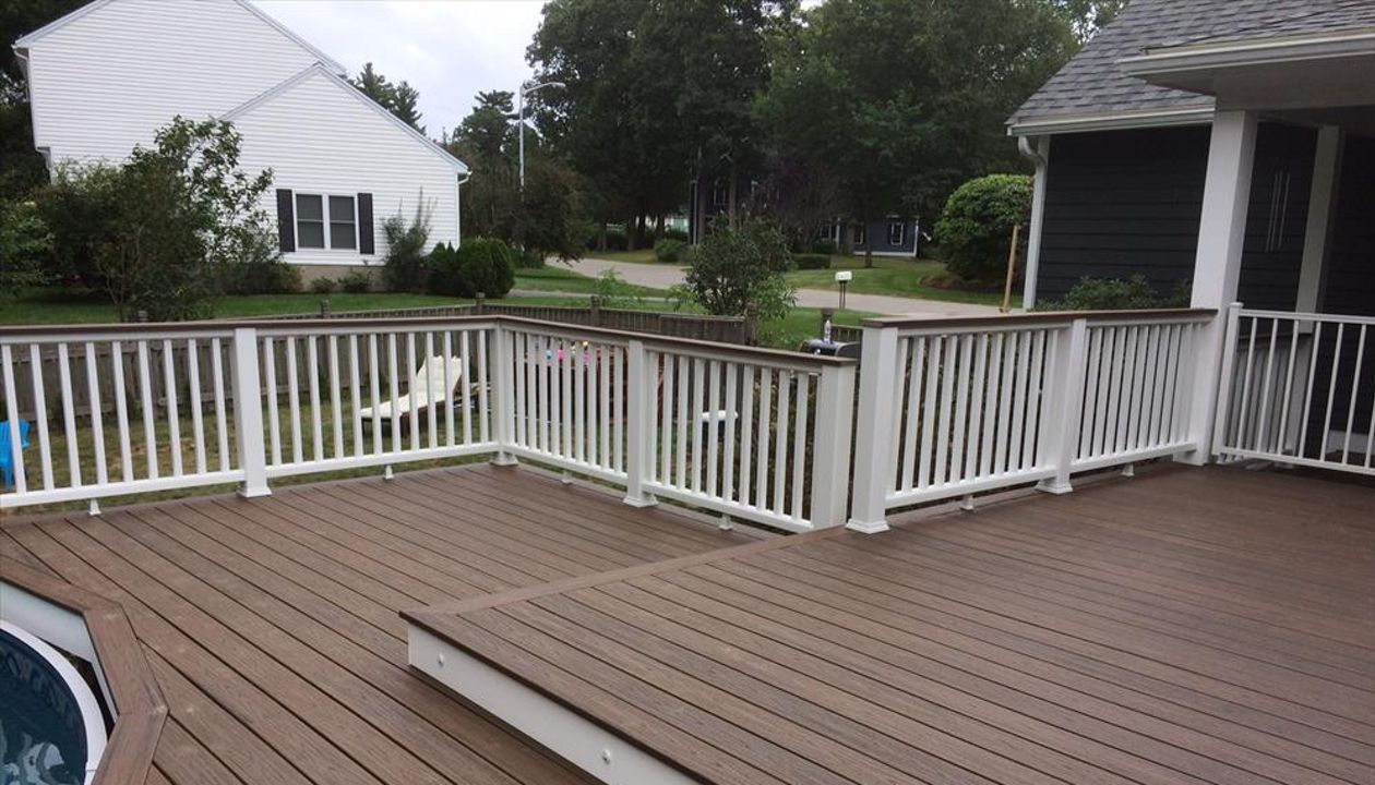 Trex Spiced Rum decking and cocktail railings built around new above ground pool.  Also some riser lights to highlight the step down