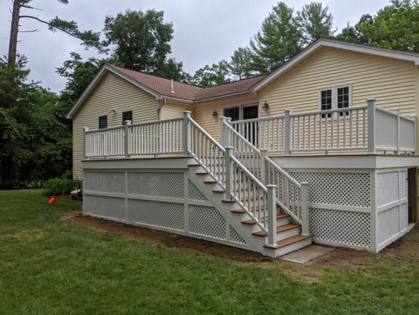 Trex Transcend "Tiki Torch" decking with white Transcend railings.
