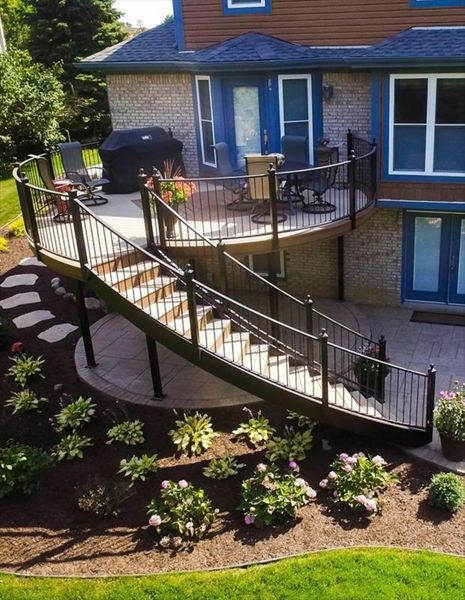 This Trex deck located in Plymouth, MI has Trex enhanced beach dune decking with saddle inlay. The foundation is composed of Goliath Tech helical piers.