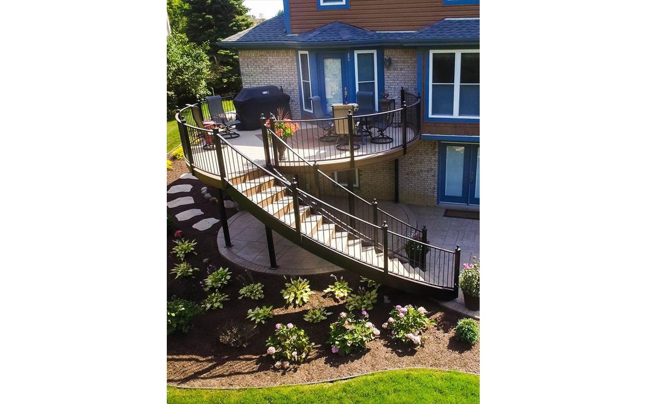 This Trex deck located in Plymouth, MI has Trex enhanced beach dune decking with saddle inlay. The foundation is composed of Goliath Tech helical piers.