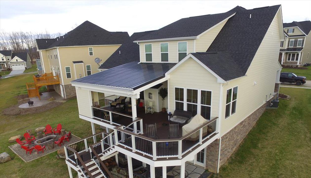 Trex Transcend Vintage Lantern w/ Spiced Rum Borders.  Trex Universal top/bottom rails w/ cocktail cap and black aluminum balusters