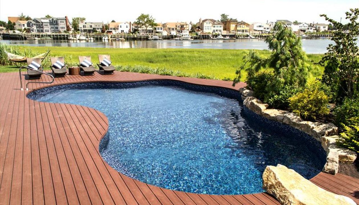Free formed pool with Trex decking