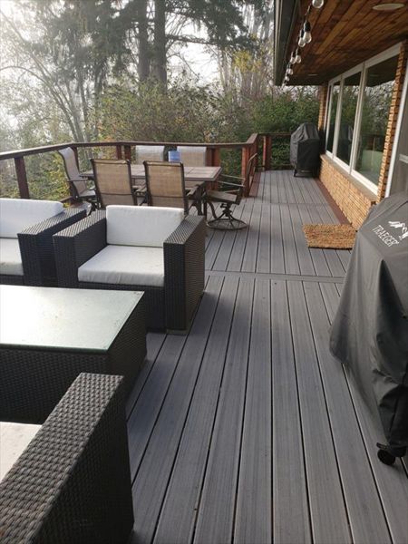 Trex Contour Chateau Grey with cedar cable rails.