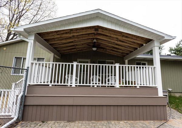 Here we built a new deck as well as a roof overhead to enjoy even in the rain!