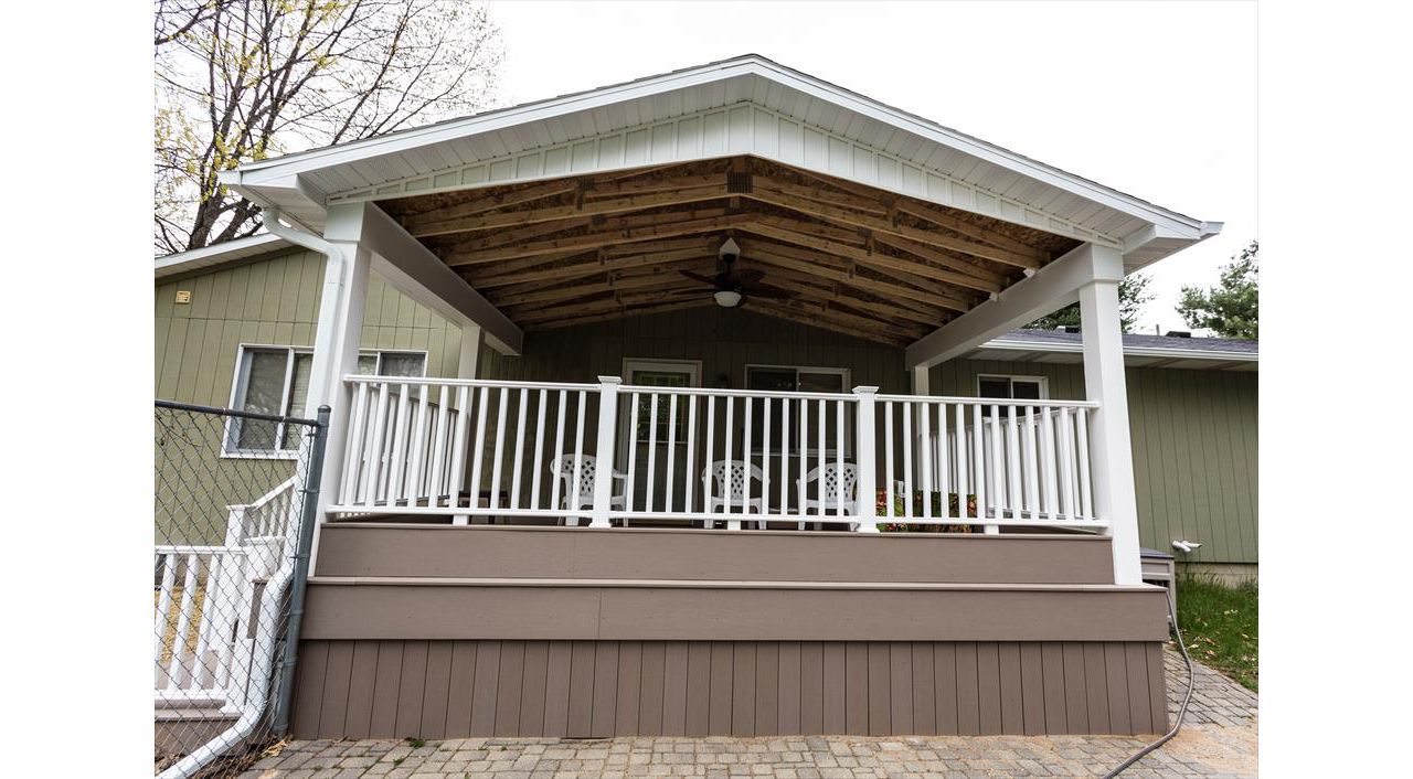 Here we built a new deck as well as a roof overhead to enjoy even in the rain!