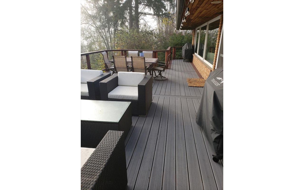 Trex Contour Chateau Grey with cedar cable rails.