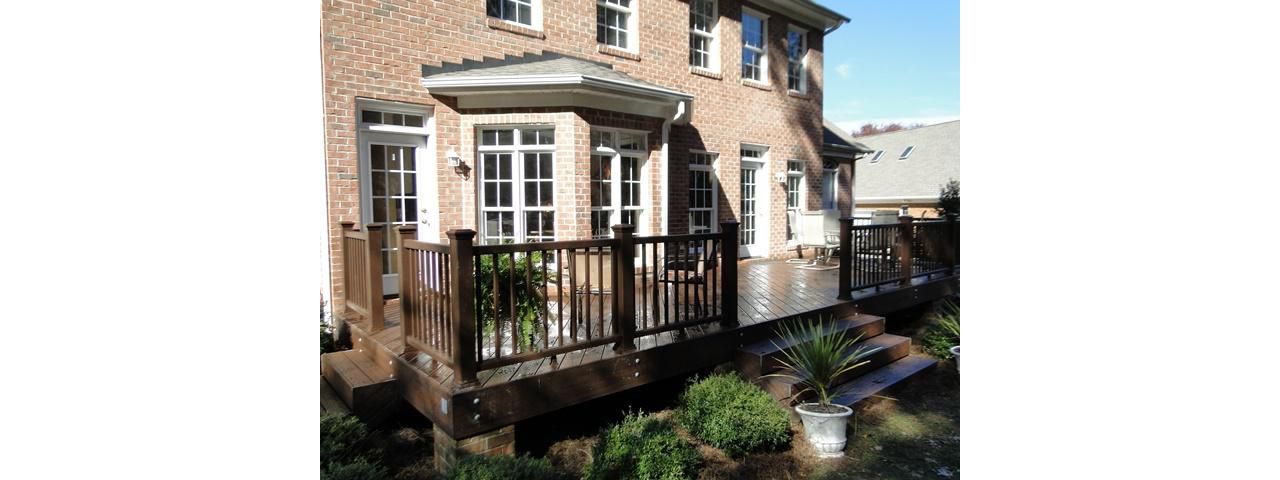 Trex Transcend Lava Rock compliments this brick home