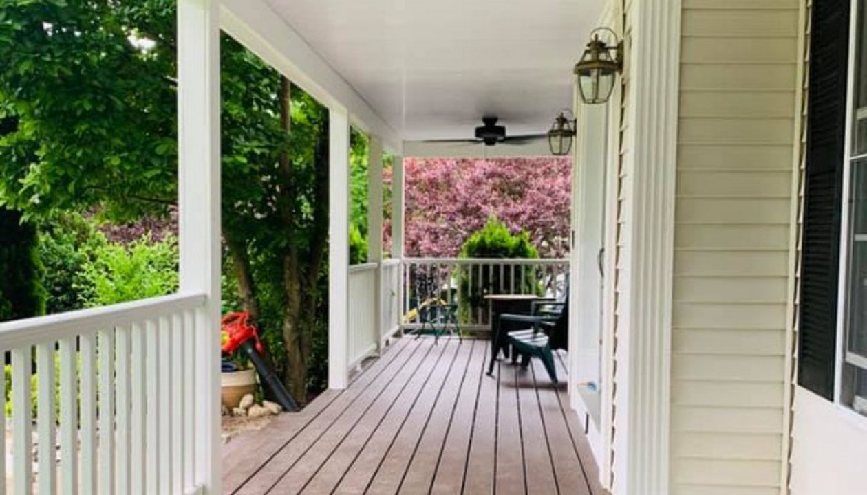 Vintage lantern farmers porch with Transcend railings