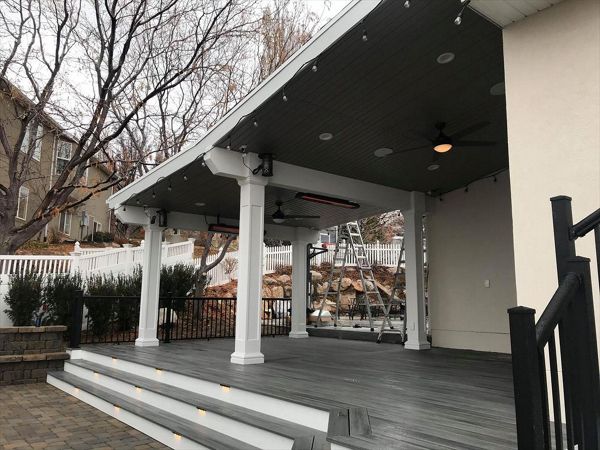 island mist with white fascia trex, deck lighting, roof build with ceiling fans, drop heaters and tv