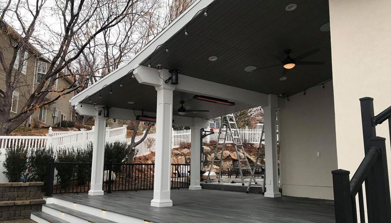 island mist with white fascia trex, deck lighting, roof build with ceiling fans, drop heaters and tv