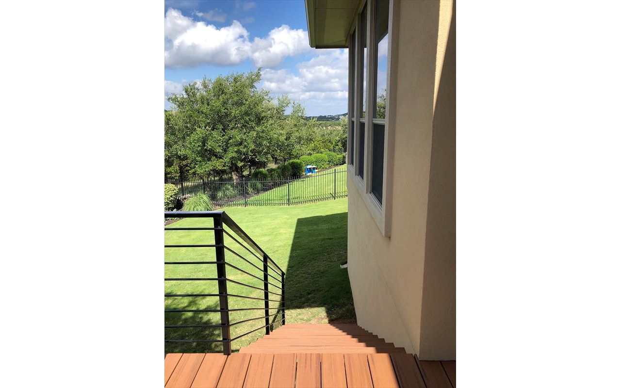 Custom Trex Transcend Tiki Torch composite deck by Austin Deck Company, Austin, TX
