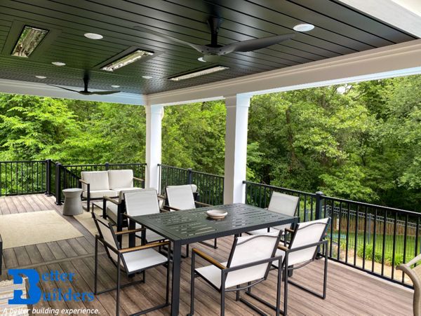 Signature railing, lighting, and Trex Rain Escape - Better Builders of Iowa - Covered deck project in Waukee, IA